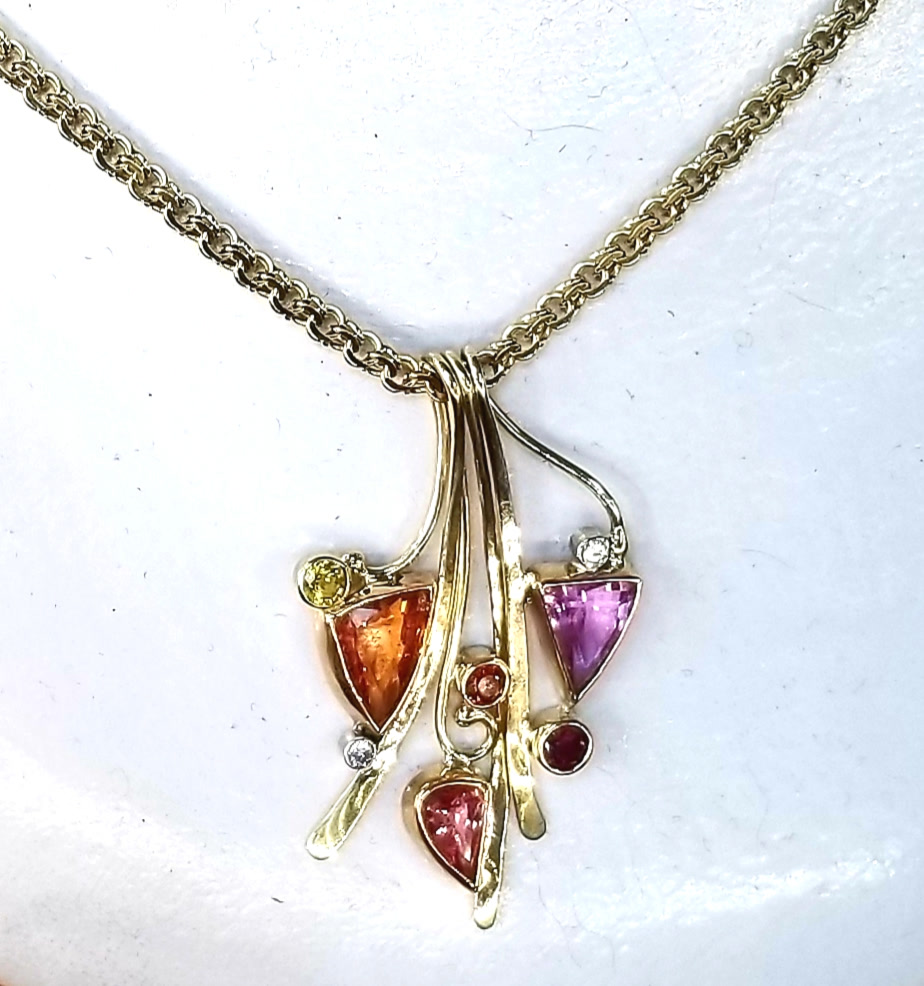Three sapphire pendants