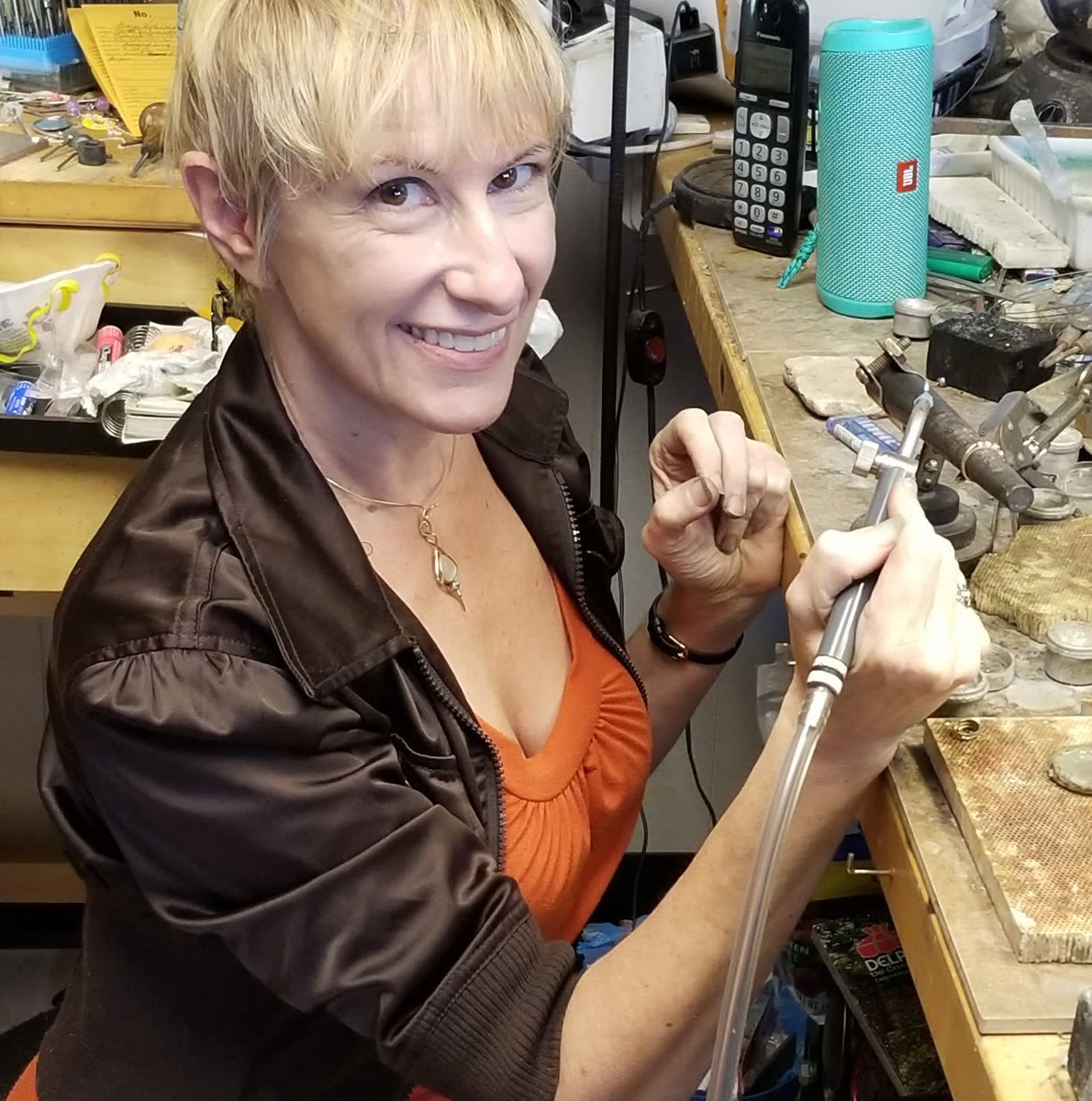 Stephanie Long, working at the soldering bench